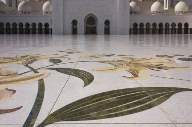 ABU DHABI, UAE - DECEMBER 28 2017: detail of the mosaic floor of the mosque