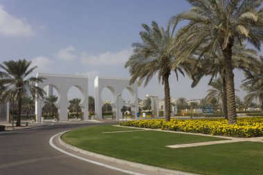 ABU DHABI, UAE - DECEMBER 28 2017: Flowerbed at the entrance of Abu Dhabi mosque