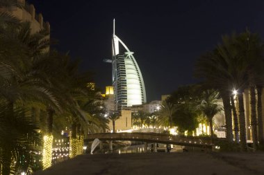 DUBAI, UAE - DECEMBER 29 2017: Night view of Burj al Arab from Madinat souq