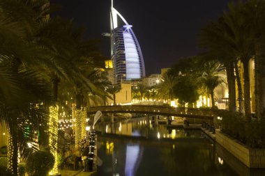 DUBAI, UAE - DECEMBER 29 2017: Night view of Burj al Arab from Madinat souq
