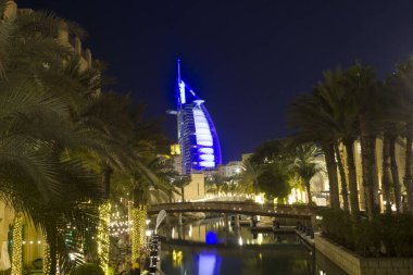 DUBAI, UAE - DECEMBER 29 2017: Night view of Burj al Arab from Madinat souq