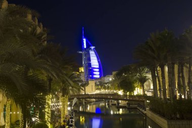 DUBAI, UAE - DECEMBER 29 2017: Night view of Burj al Arab from Madinat souq