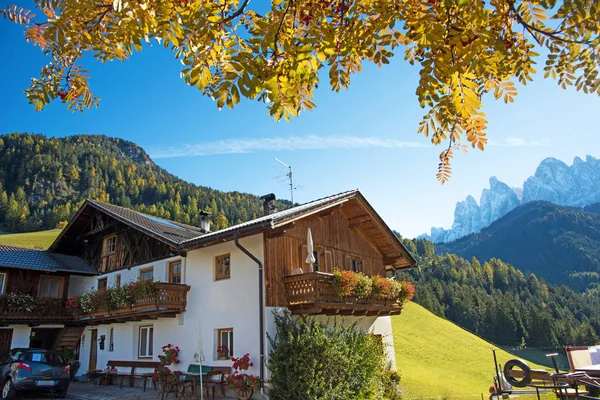 Magical relaxing autumn landscape with a hut on the background o