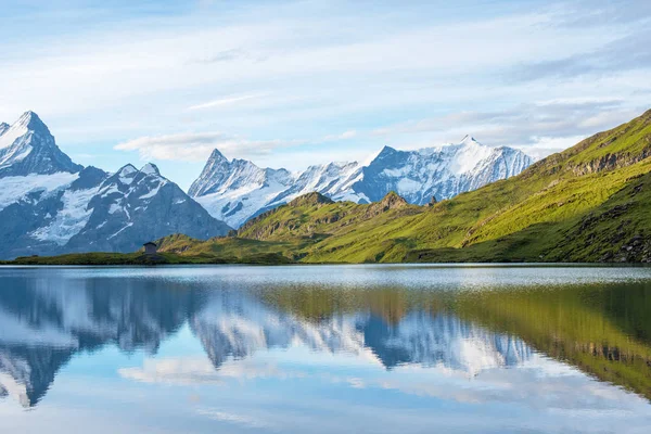 A magical landscape with a lake in the mountains in the Swiss Al