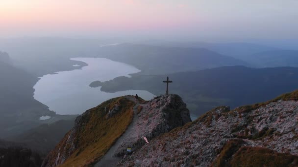 Hiker girl at summit of Schafberg mountain sunset — Stock Video