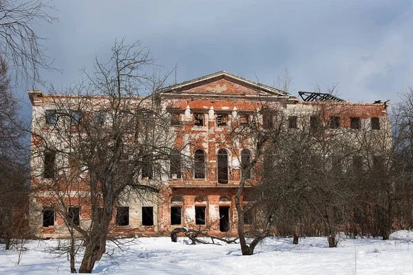 Abandoned Grebnevo mansion with old garden in winter