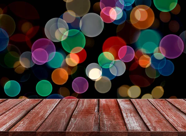 Viering achtergrond van houten tafelblad op kleurrijke bokeh — Stockfoto