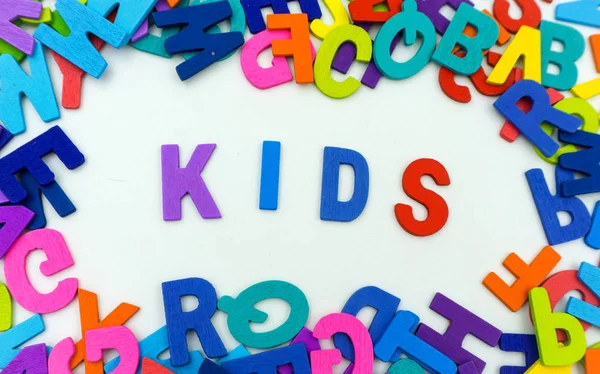 The letters made of plywood the words kids are on a white backgr — Stock Photo, Image