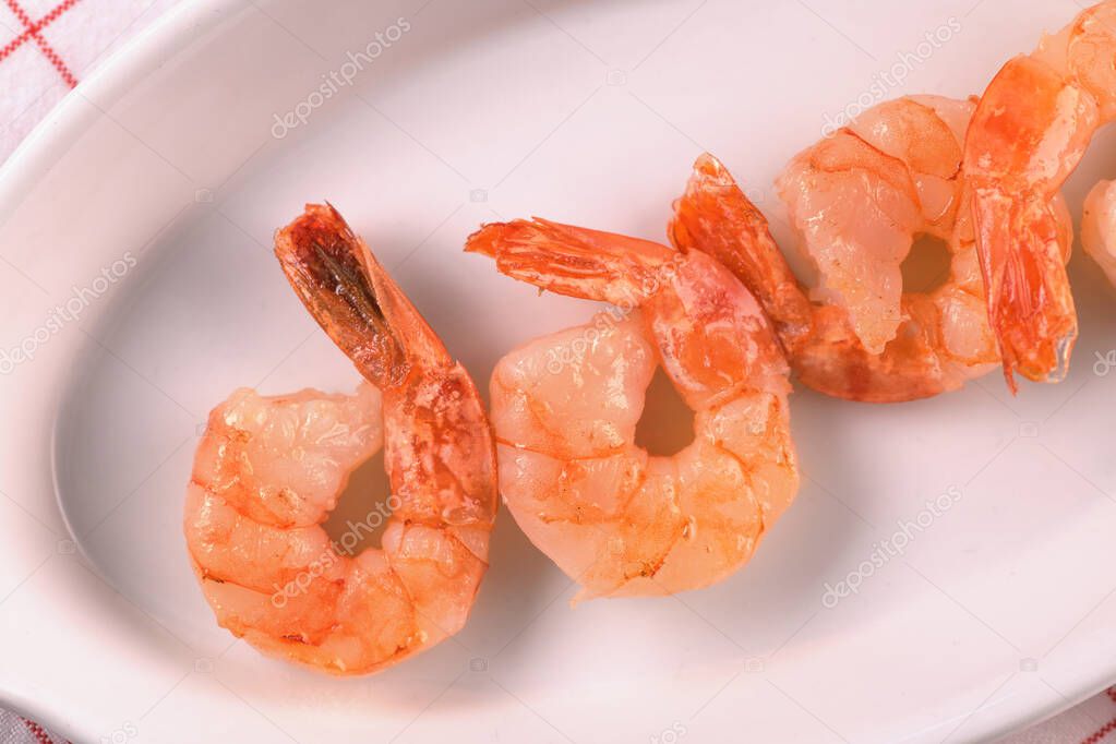 shrimp, boiled shrimp on a white plate