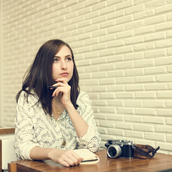 Woman Thinking and writing notes — Stock Photo, Image