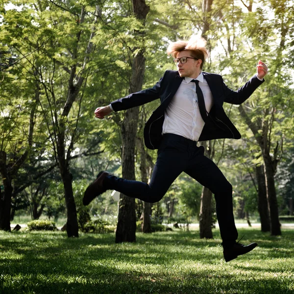 Businessman at outdoors jumping — Stock Photo, Image