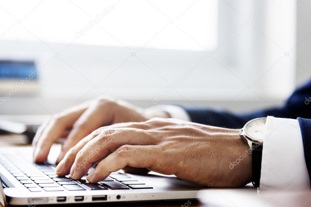 Businessman Typing on Keyboard Laptop 