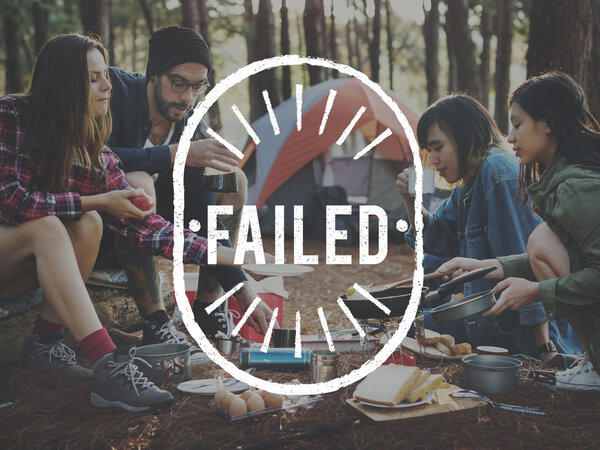 friends cooking outdoors in forest 