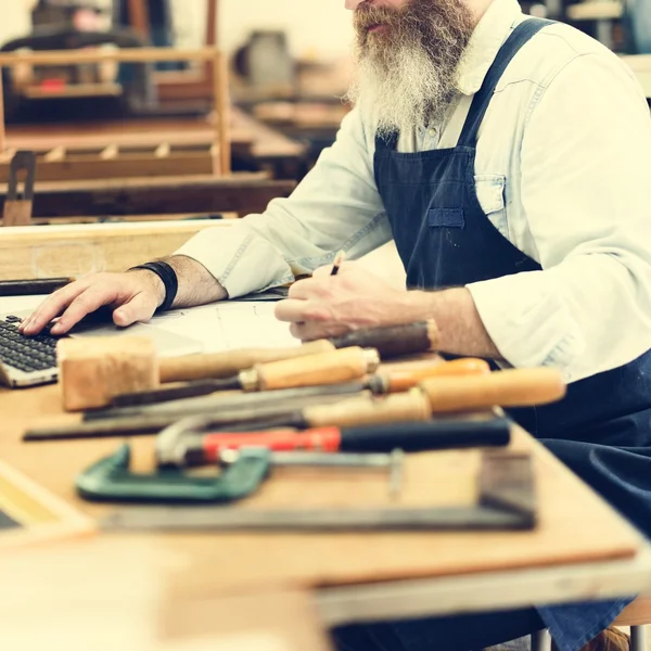 Craftsman working in workshop studio — Stock Photo, Image