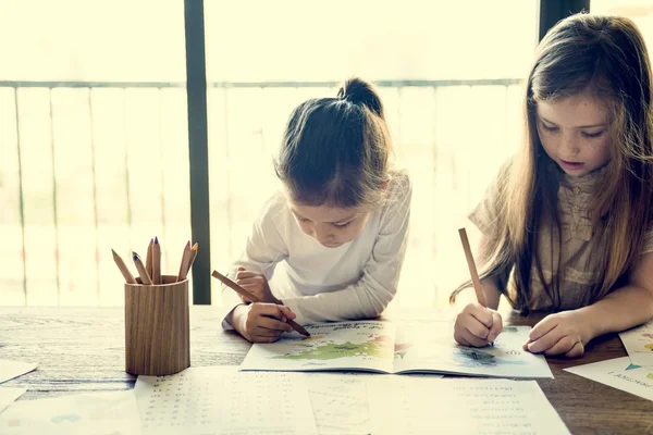 Girls Drawing in coloring-book — Stock Photo, Image