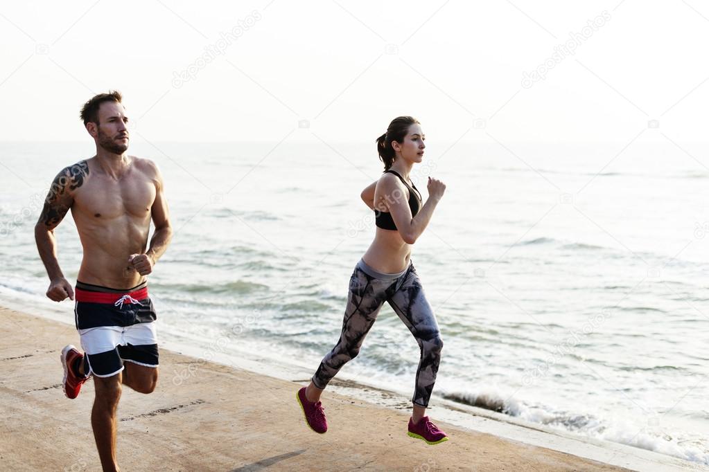 couple running on beach