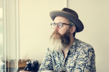 hipster senior man in hat