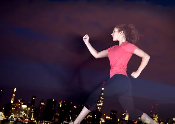 Woman jogging through New York