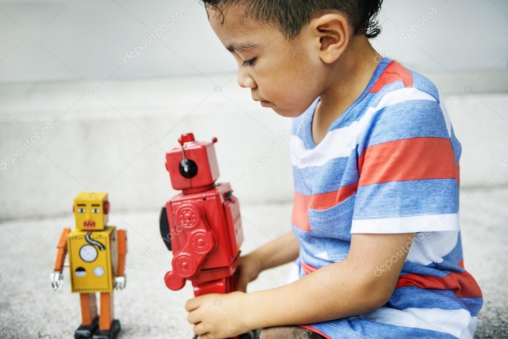 Boy Playing with Robot