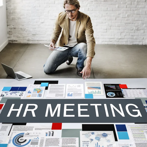 Businessman working near poster — Stock Photo, Image