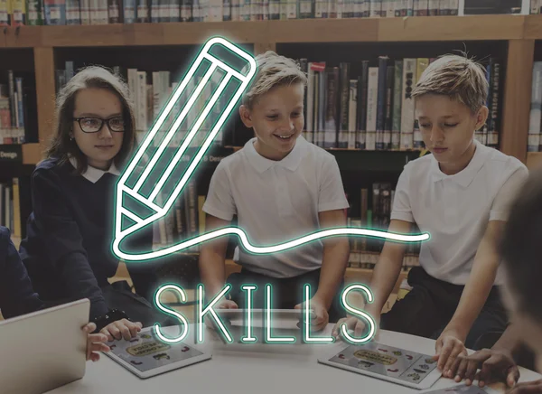 Classmates with digital tablets at school library — Stock Photo, Image