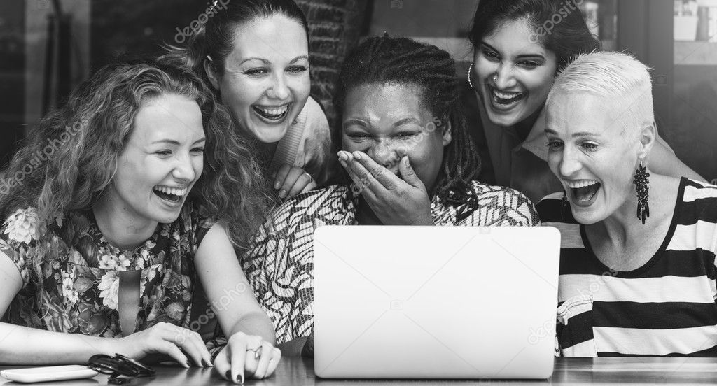  friends looking at laptop 