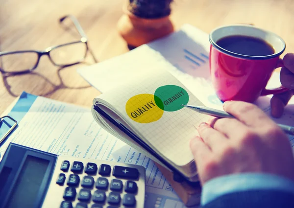 Businessman writing notes in diary — Stock Photo, Image