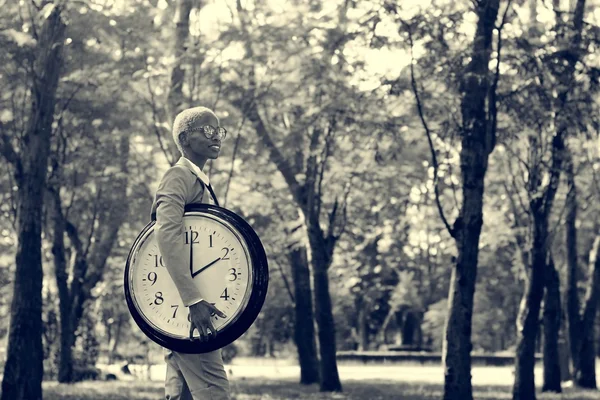 Businessman with round clock — Stock Photo, Image