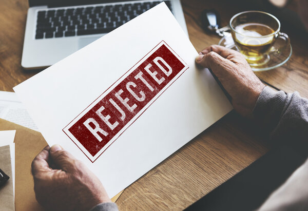 senior man holding paper 