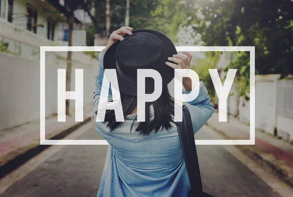 Woman in hat walking at street — Stock Photo, Image