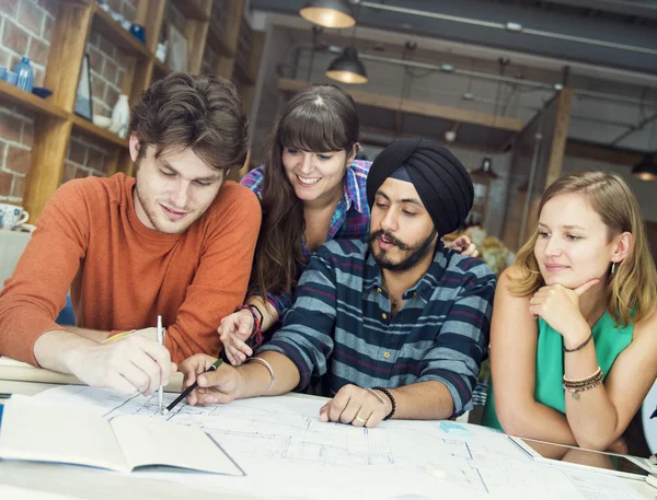 Architect students working in cafe — Stock Photo, Image