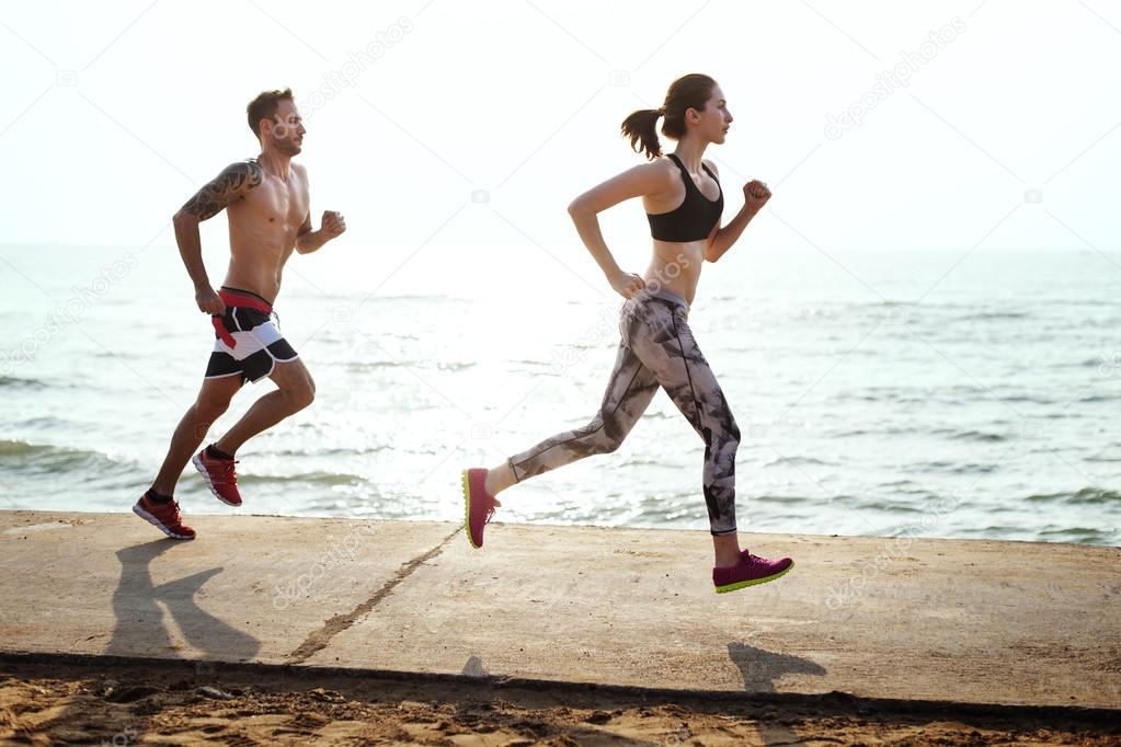 couple running on beach