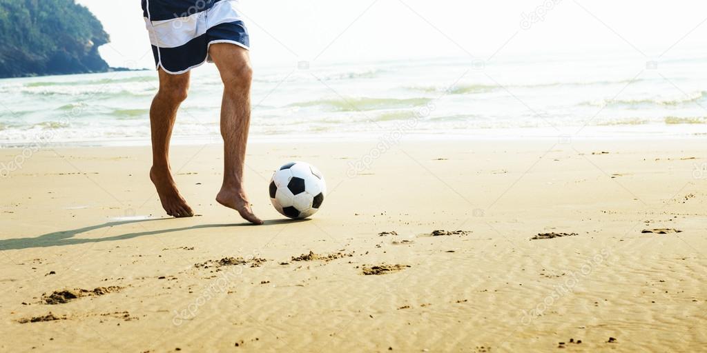 Man playing Beach Football 