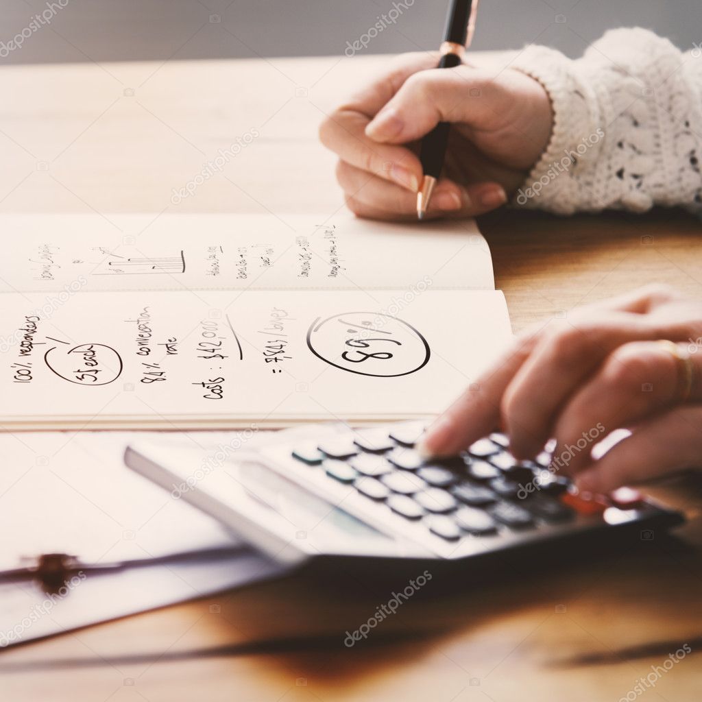 person writing on white paper
