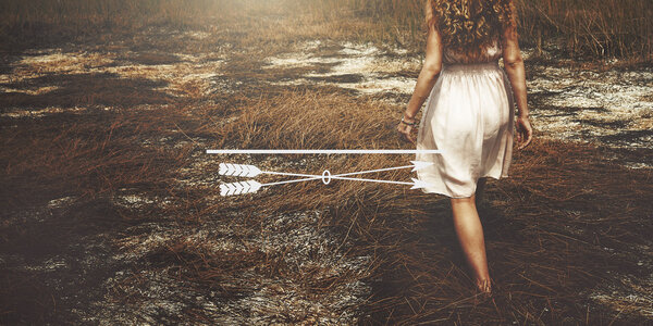Woman in white skirt walking on dry grass, summer concept and text: