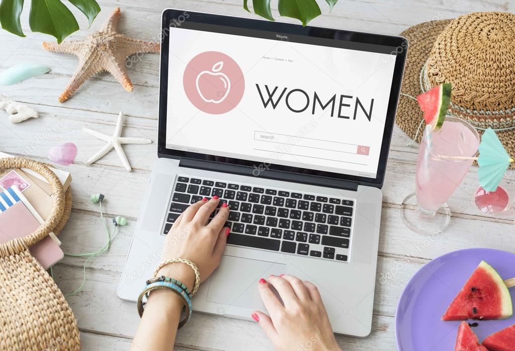 Woman typing on laptop keyboard