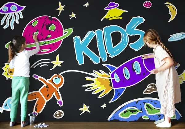 Girls drawing on Blackboard — Stock Photo, Image