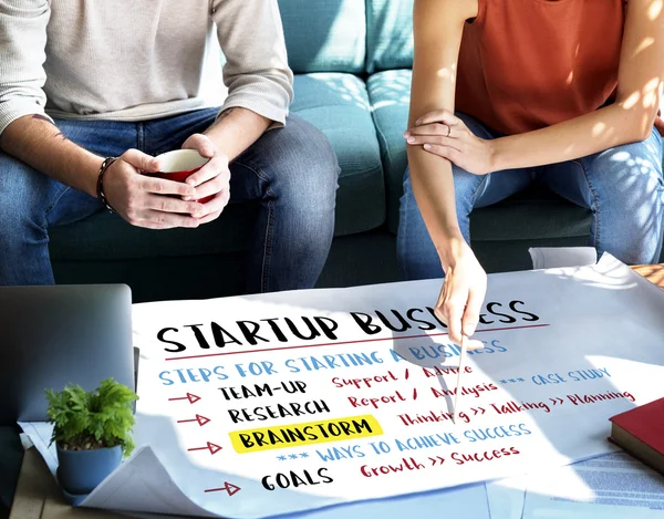 Woman showing on poster with Start Up — Stock Photo, Image
