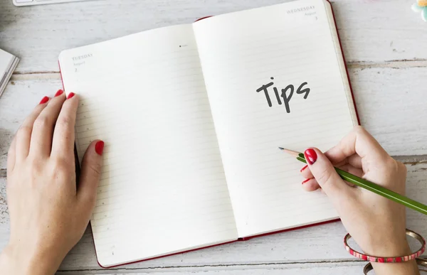 Woman writing in diary — Stock Photo, Image