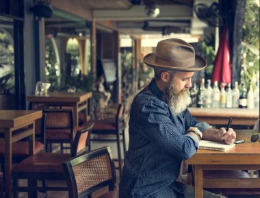hipster senior man in hat