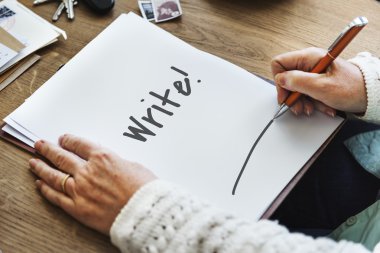 person writing notes on white paper clipart