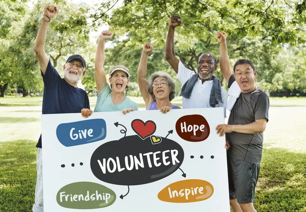 Senior Friends holding board — Stock Photo, Image