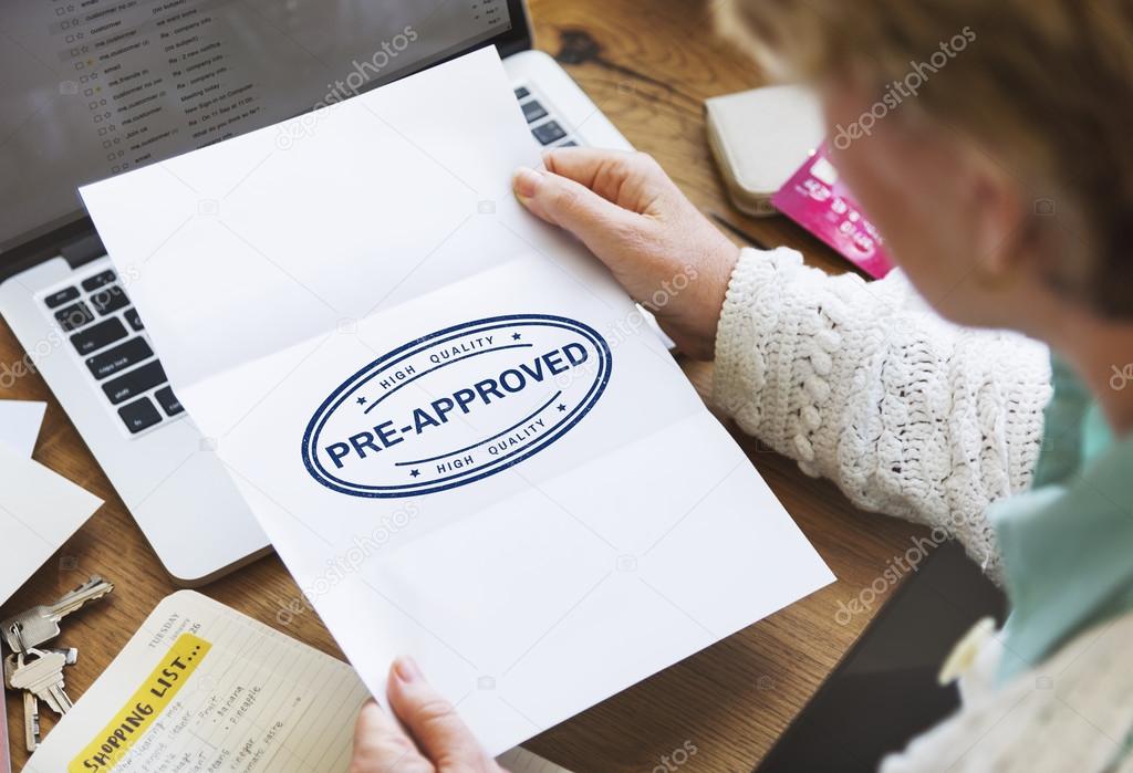 senior woman holding white paper