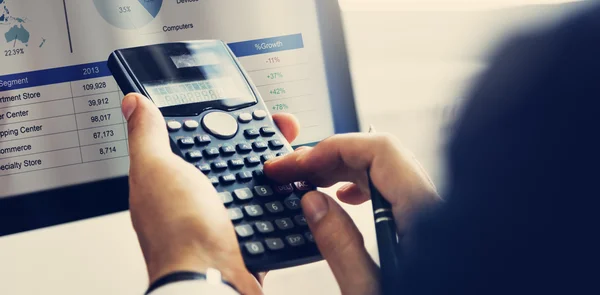 Businessman using Calculator at work — Stock Photo, Image