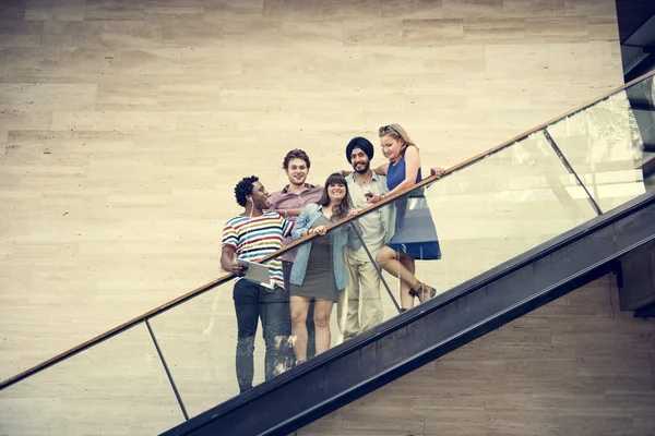 Friends standing on the stairs — Stock Photo, Image