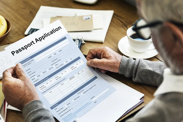 Senior man holding application form — Stock Photo, Image