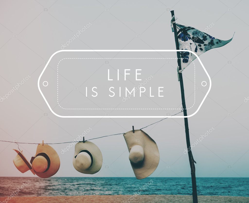 Summer hats on beach, Concept Life Is Simple