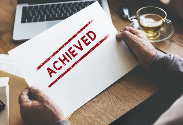 Senior man holding paper — Stock Photo, Image