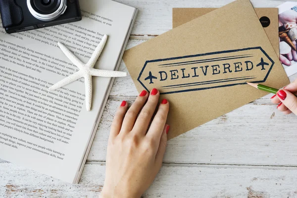 Woman writing on postcard — Stock Photo, Image