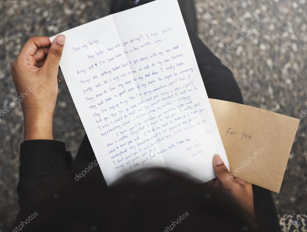 human hands holding Letter 